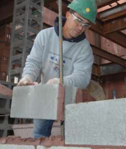 Man placing CMU
