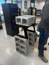 Two concrete blocks being supported between a beams of concrete blocks